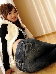 Emiri Seo poses in a room on floor