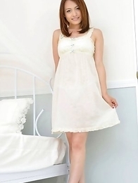 Rina Itoh smiles and shows sexy legs under cute dress