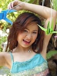 Anna Chung gets so excited that she displays her boobs. Then suddenly, she lifts her dress up and reveals her panties
