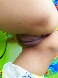 Iko Yeung loves the spotlight as she gets into her routine. She spreads her pussy lips open with her hands as she lies on the bed.