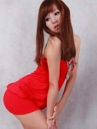 Sandy on heels shows hot behind in red dress for pictures