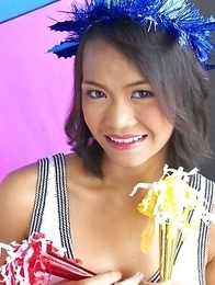 Gok Grongring is so sexy that you will want her cheering for you team. She kneels on the ground with her pom poms on the floor.