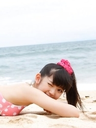 Airi Suzuki in cute bath suit enjoys hot sand on her curves