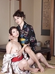Hot Maki Hojo and Tsubaki Kato in kimonos rub each other hairy pussy.