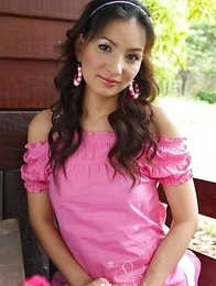 View the wonderful Annita Sang as she sits on a wooden porch in her pink top View the wonderful Annita Sang as she sits on a wooden porch in her pink top